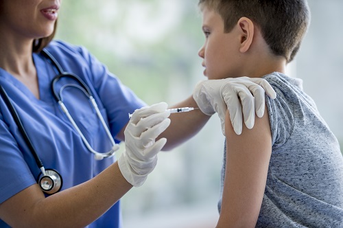 Child being administered a vaccine